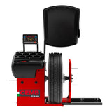 Tire balancing machine with a red base and digital display panel.