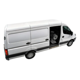 Silver cargo van with an open side door showcasing the space saving wheel balancer