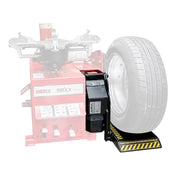 Tire balancing machine attachment with a mounted car wheel.