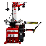 Tire changing machine with red base and various mechanical components.