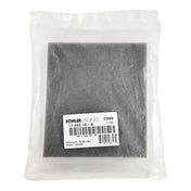 Sealed plastic bag containing a gray square component labeled with a Kohler part number.