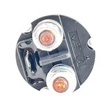 Circular electrical component with two metal contacts and visible copper wiring.