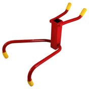 Red metal tool with curved arms and yellow tips, likely for lifting or gripping.