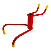 Red metal frame with yellow-capped ends resembling a simplified human figure.