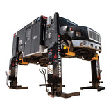 Heavy-duty vehicle lift supporting a truck or large commercial vehicle.