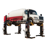 Heavy-duty truck lifted on a set of four mobile column lifts for maintenance or repair.