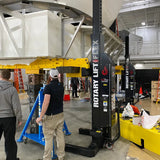 Heavy-duty hydraulic lift or jack system with yellow support structures.