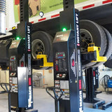 Tire balancing machines in an automotive service center.