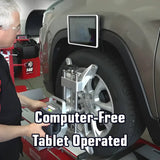 Wheel alignment machine with a tablet-like display attached to the vehicle’s wheel.