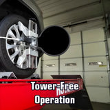 Wheel alignment machine attached to a vehicle’s tire.