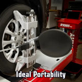 Portable wheel balancing machine attached to a car wheel.